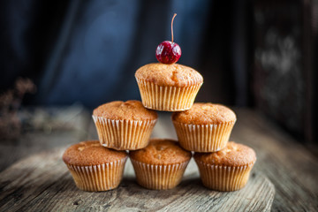 Homemade muffins with a cherry on top. Homemade cupcake. sweet and delicious pastries. Still life.