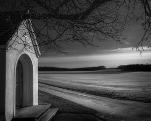 A small chapel with panoramic views, flooded with light and shadows