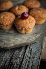 Homemade muffins with a cherry on top. Homemade cupcake. sweet and delicious pastries. Still life.