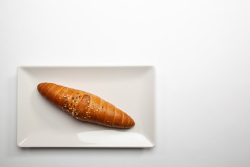 French baguette on the white table.