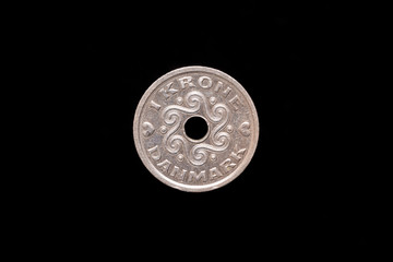 1 Danish Krone coin Queen Margrethe II from 1996, reverse. Isolated on black background