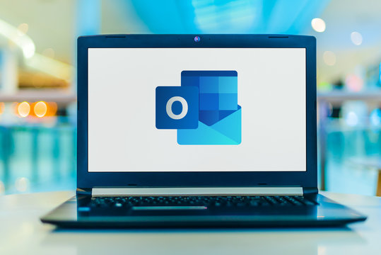Laptop computer displaying logo of Microsoft Outlook