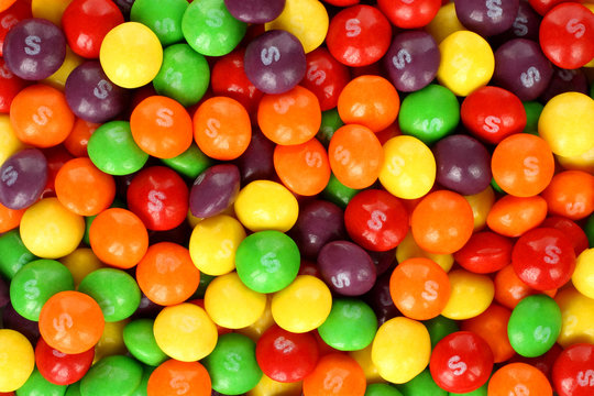 Skittles multicolored fruit candies background