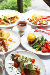 Gourmet meat meals assortment flat lay. Top view on restaurant table with menu of tasty grilled snacks. Concept for restaurant menu.