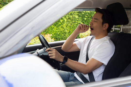 Tired Young Man Sleep In Car, Hard Work Causes Poor Health, Sit Asleep While The Car Is On A Red Light, Traffic Jam Or Overworked Concept