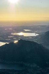 Nature and landscape during the late afternoon seen from the Lombard Mountains above the city of Lecco, Italy - February 2019.