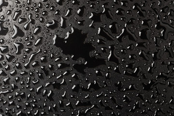 Abstract wet black texture for background. Copy space