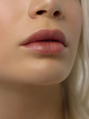 Closeup plump Lips. Lip Care, Augmentation, Fillers. Macro photo with Face detail. Natural shape with perfect contour. Close-up perfect natural lip makeup beautiful female mouth. Plump sexy full lips