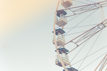 Obraz premium Ferris wheel and piece sunlight. Vintage style. Close-up.