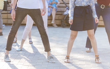Social dance and flashmob concept - Fun and dance with in the summer on a city street. Close-up of...