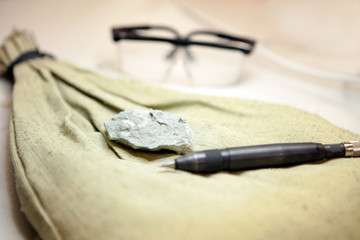 Fossils extraction from the limestone at geology laboratory. Stone samples at geological laboratory. Geology rock laboratory. Laboratory for analysis of geological soil materials, stones, minerals