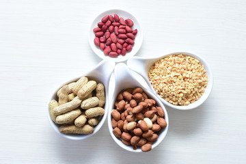 Dried peanuts (Arachis hypogaea) peanuts in shells, whole and chopped in containers