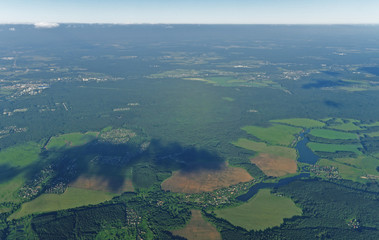 View from great height to plain with forests and villages in central Russia