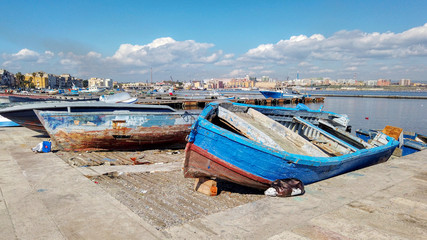 Fototapeta na wymiar Overview with old fishing boats in the old city of Taranto, Puglia, Italy