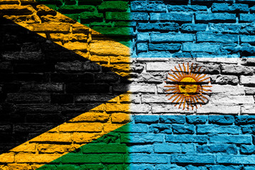 Flag of Jamaica and Argentina on brick wall