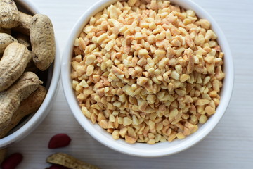 (Arachis hypogaea) chopped peanuts in containers