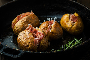 Baked potatoes with hamon and cheese