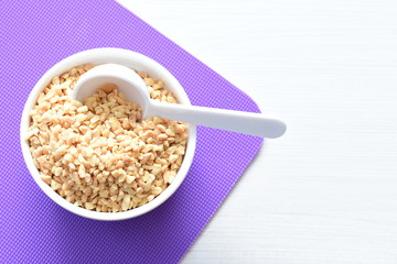 (Arachis hypogaea) chopped peanuts in containers