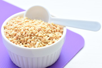 (Arachis hypogaea) chopped peanuts in containers