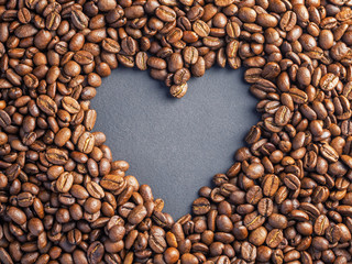 Heart coffee frame made of coffee beans on burlap texture