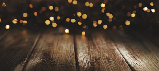 wooden background with defocused lights.