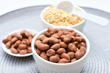 (Arachis hypogaea) dried whole peanuts without husk and chopped in containers