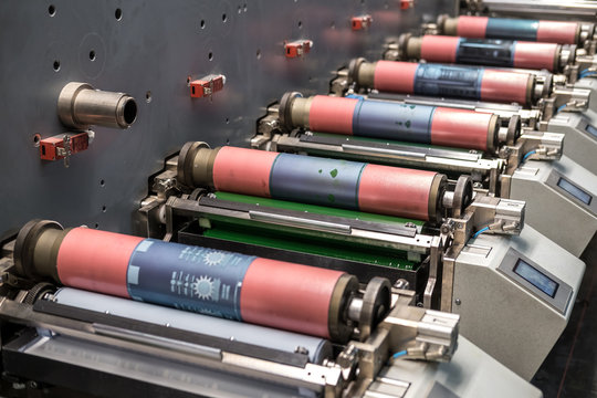MINSK, BELARUS - JANUARY 2020: Rows of Large offset printing press. moving polymer label conveyor typography facility and flexographic printing