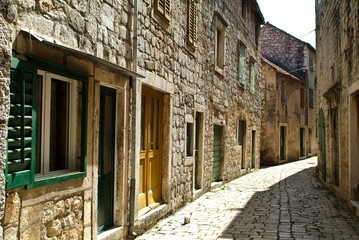 Fototapeta na wymiar Limestone cobbled street in Stari Grad on the Island of Hvar, Croatia