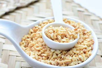 (Arachis hypogaea) chopped peanuts in containers