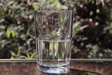 Glass of water. Natural background