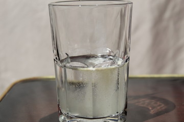 Vitamin powder in a glass with water.
