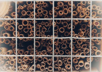 Different pieces of wood folded behind bars