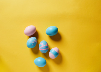 pastel easter eggs on yellow background