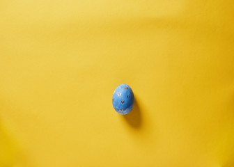 pastel easter eggs on yellow background