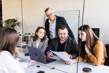 Business team is working with the financial schedules in the workplace in the office