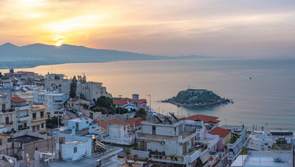 Fototapeta premium Sunrise over Piraeus, the city port near Athens in Greece with Koumoundourou island in the distance
