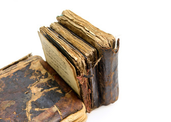 The old, worn and patched Qur'anic religious book.