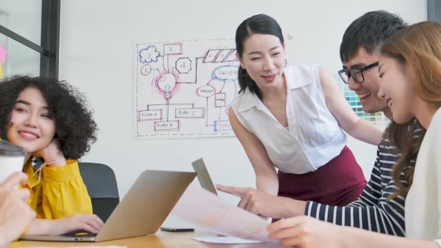 Group of asian young creative happy people entrepreneur on a business meeting office background Good leadership and teamwork lead to success
