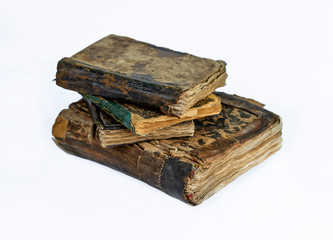 The old, worn and patched Qur'anic religious book.