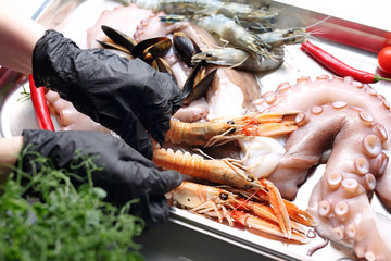 Seafood, appetizing cuisine using shellfish and seafood. Composition of seafood, vegetables and...