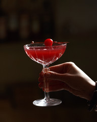 Alcoholic cocktail on the bar. The process of making an alcoholic cocktail.