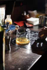 bartender makes original tea with cinnamon and apples