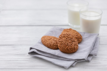 Easter egg shaped gluten free ginger cookies on the kitchen towel background, selective focus