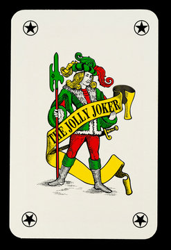 Playing Cards; Suit of Spades, Clubs and Diamonds fanned out over black background. Gambling, Poker, Win, Lose, Chance, Gambling, Money, Red, Black, Joker