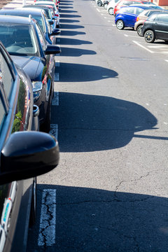 Busy street parking in small city in Spain