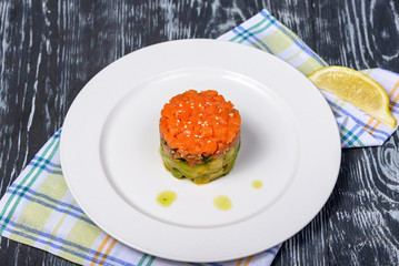 snack of lightly salted trout and avocado with sesame seeds