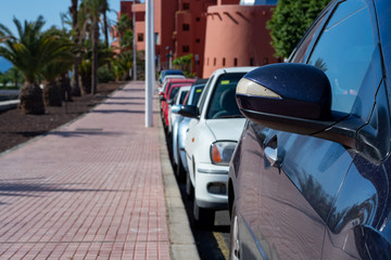 Busy street parking in small city in Spain