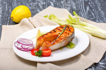 grilled trout with tomatoes, red onion, celery and lemon