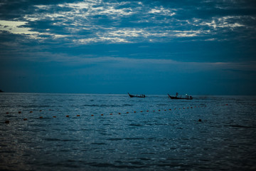 evening sea in thailand, waves and boats