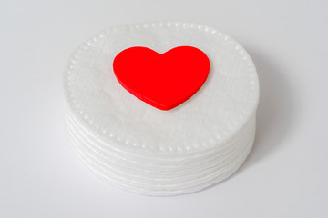 Close-up of cotton pad, Red heart copy space, hygienic cosmetic and healthcare accessory